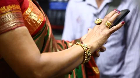 Shot of a Indian bride putting on bangles in her hand Stock Footage 42146078