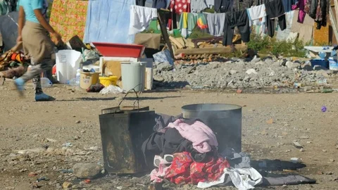 Shot inside a Romanian camp in Shkodër, Albania, cooking Stock Footage 84680073