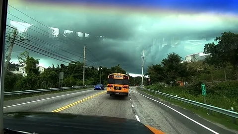 Shot Inside a School Bus Driving on a Cloudy Day Stock Footage