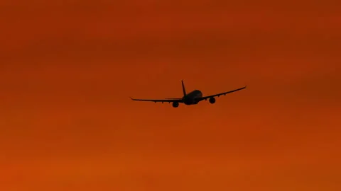 Shot of jet plane in sunset sky Stock Footage 328329644