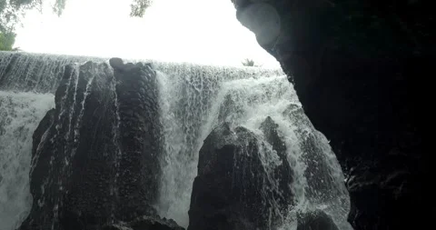 Shot of a large waterfall in bali during an adventurous trip through Stock-Footage 242501602