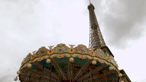 Shot looking up at Eiffel Tower with carousel Stock Footage 114556802
