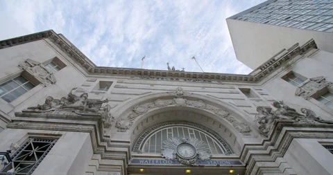 A shot looking up at Waterloo Station with clouds moving over the top Stock Footage 87340846
