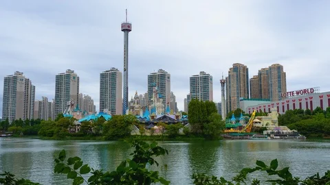 Shot of Lotte World Tower with Lotte World Adventure in Seoul, South Korea Stock Footage 120585196