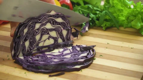 Shot of man chef cutting cabbage on chopping wooden board Stock Footage 88076780