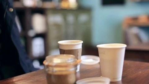 A shot of a man drinking a cup of coffee in a coffee shop Stock Footage 87857147