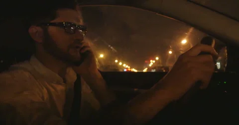 Shot of man driving at night Stock Footage 56623746