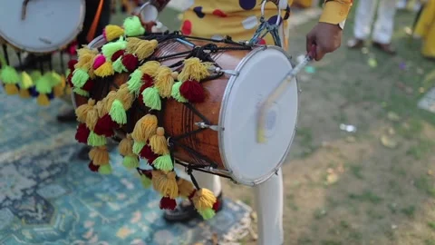 A shot of a man playing dhol at an Indian Wedding function in India 스톡 동영상 300828593
