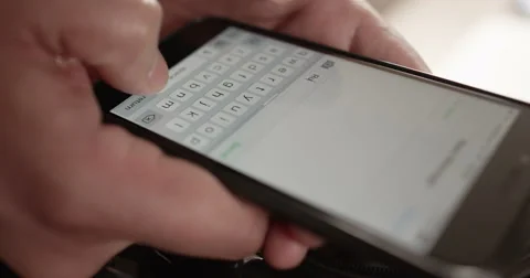 Shot of a man texting on his mobile phone. Shot on RED Epic. Stock Footage 58953825