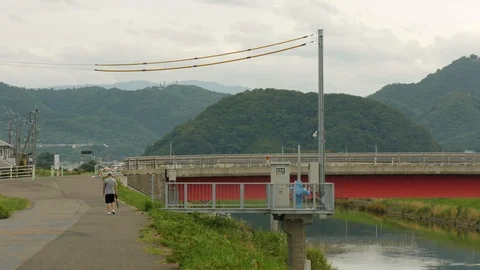 Shot of a man walking down the street in Tottori, Japan Stock Footage 92189091