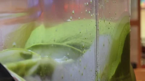 A shot of a matcha slurpee machine mixing. Stock Footage 306994557