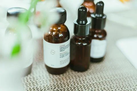 Shot of mature perfumer adding extra essential oil Stock Photos