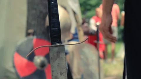 Shot of Medieval Sword and Shield in the Background Stock Footage 105813142