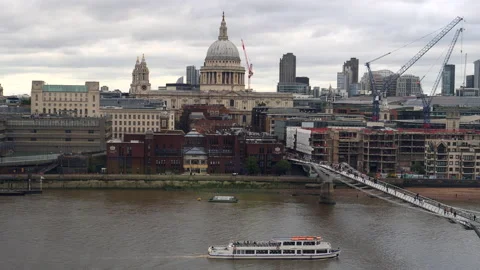 Shot of Millenium Bridge, old and new buildings in the city.  London, UK. Stock Footage 208147084