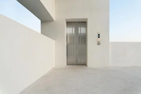 Shot of a modern elevator and a white wall with minimal style Fotos de archivo