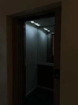 Shot at night of a elevator open doors in a empty floor, night, interior, dark Fotos de archivo