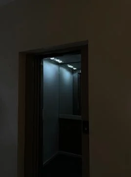 Shot at night of a elevator open doors in a empty floor, night, interior, dark Fotos de archivo