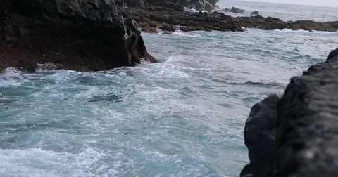 Shot of ocean waves splashing on shore Stock Footage 80159174