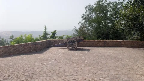 A shot of an old cart on a panoramic stone terrace Stock Footage 344254718