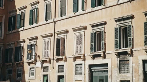 A shot of a older building with windows open to the allow the sun light in. Stock Footage 328735854