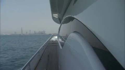 Shot on one side on the deck of a boat while sailing off the coast of Dubai. Stock Footage 46866110