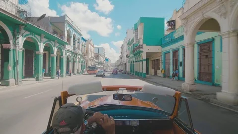 Shot from an open top Cuban Classic car on a colorful street in Havana Stock Footage 88764229