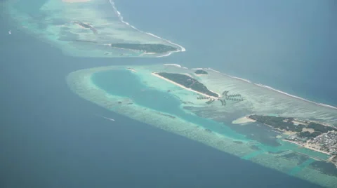 Shot out of the window of a propeller hydroplane flying over the Maldives Stock Footage 46510739