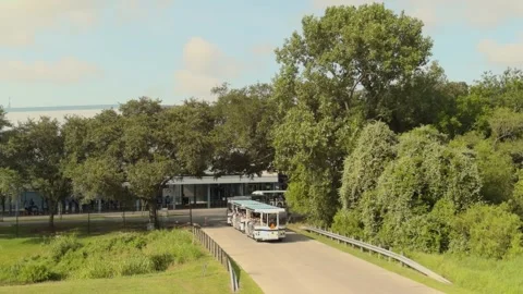 A shot of the people mover tram returning visitors to Space Center Houston. Stock Footage 342216461