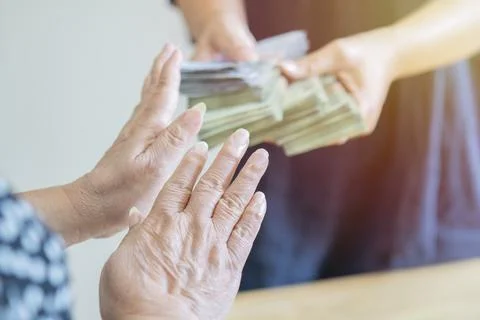 Shot of a person refusing bribe given money by partner with anti bribery co.. Stock Photos