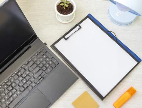 Shot of the plastic folder on the office desk with paper clip holder on the.. Foto stock