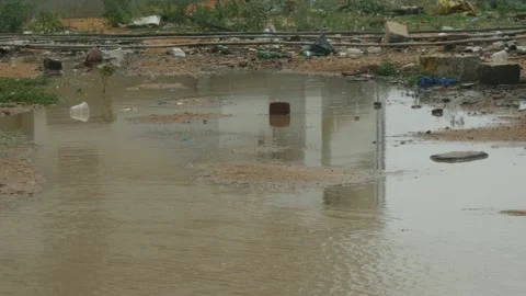 Shot plastic waste flowing over water surface Vídeo Stock 156990814