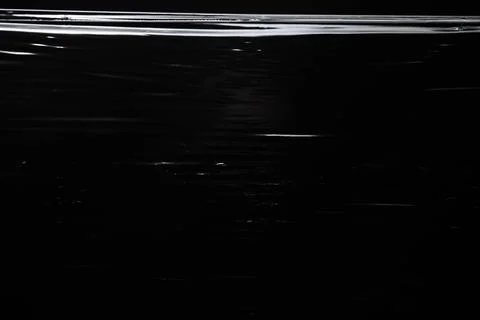 Shot of the plastic wrap on black background Stock Photos