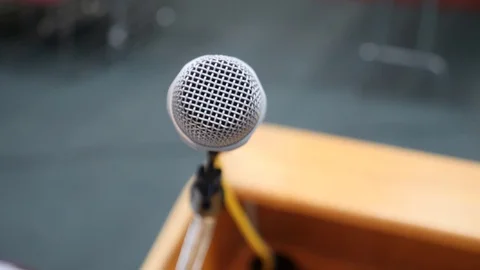 Shot of Podium Microphone Stockbeeldmateriaal 128539502