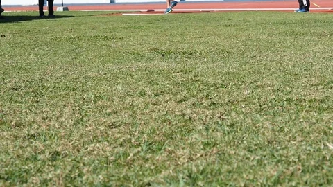 Shot put ball was thrown on the field by a athlete in the sport stadium. Stock Footage 107874507