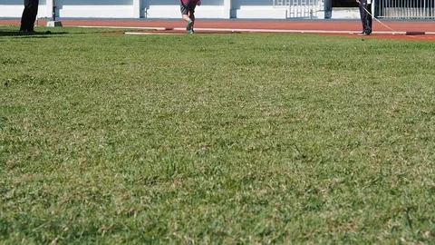 Shot put ball was thrown on the field by a athlete in the sport stadium. Stock Footage 108324481