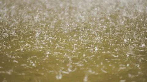 Shot of rain falling on water. Stock Footage 304576280