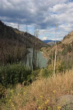 A shot of a river going through steep hills. Stock Photos