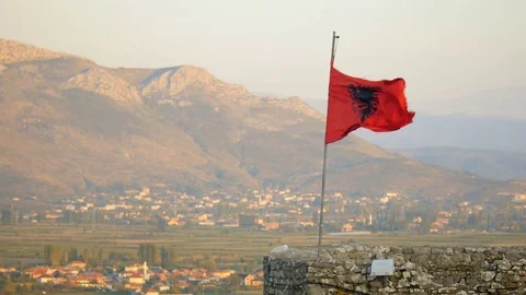 Shot from Rozafa Castle in Shkodër, Albania, flag close right Stock Footage 84682765