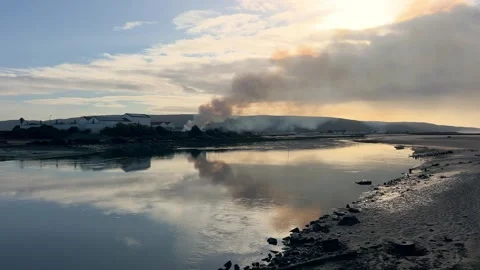 Shot of Rural Field Fire with Distant City Skyline Stock Footage 321038238