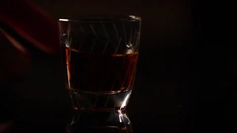 A shot of schnapps is placed on the table Stock Footage 147559514
