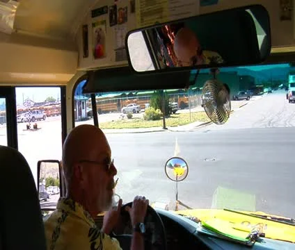 Shot of schoolbus driver looking and turning Stock Footage 21623887