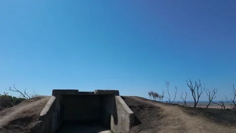 Shot of a second World War bunker with burned earth around it Stock Footage 347274568
