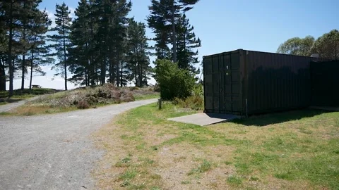 Shot of Shipping containers on grass. Stock Footage 260775471