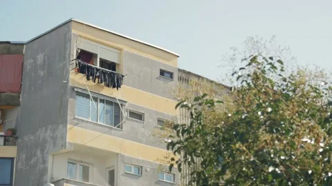 Shot in Shkodër in Albania, building with clothes outside Stock Footage 137137062