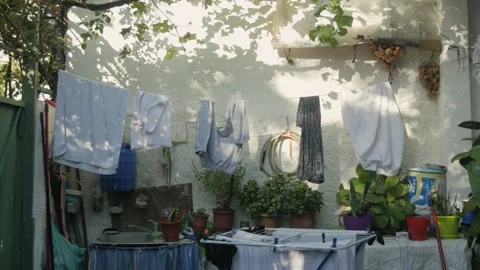 Shot in Shkodër in Albania, clothes outside at wall Stock Footage 137138842