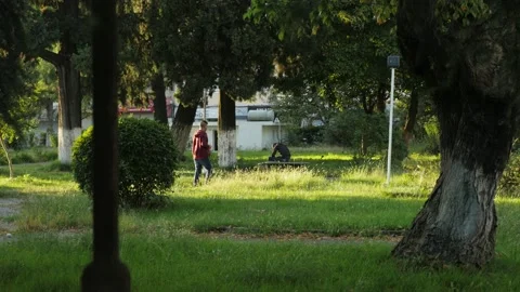 Shot in Shkodër in Albania, two people in the park on a bench Video stock 137140927