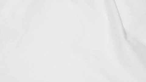 Shot showing the subtle texture and soft folds of a white fabric surface Stock Photos