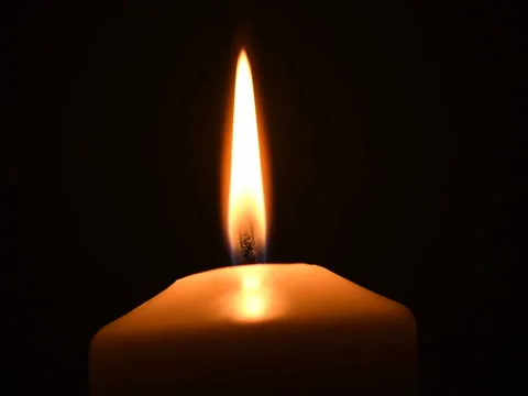 Shot of a single candle burning, isolated on black background. Stock Footage 74793602