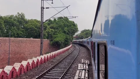 Shot of slow speed train running in Delhi, Train entering at railway station of  Video stock 347018875