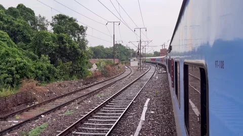 Shot of slow speed train running in Delhi, Train entering at railway station of  Video stock 347018889
